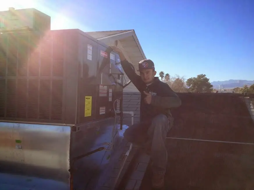 HVAC technician performing AC Tune-Up on a rooftop unit in Citrus Park